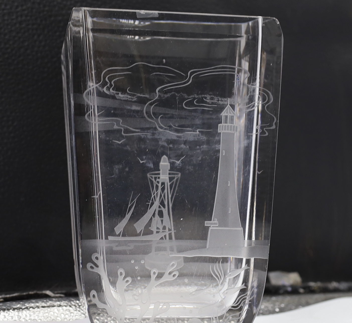 A rectangular glass vase engraved with a scene of a lighthouse and seascapes, engraved dedication base, George Saul from Aga-Graham AH, 21cm